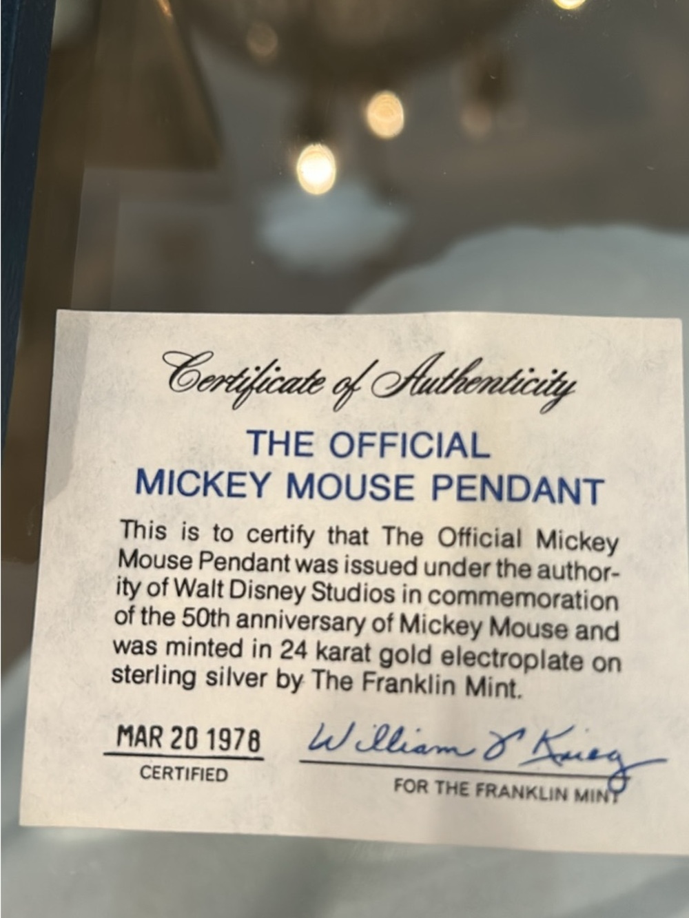 The Official Mickey Mouse Pendant Certificate - Blue & Black Text